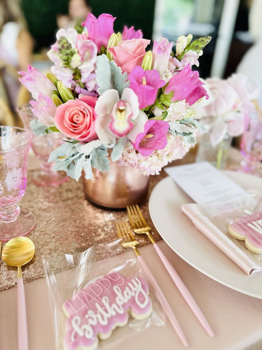 A birthday centerpiece with a hand-iced cookie.