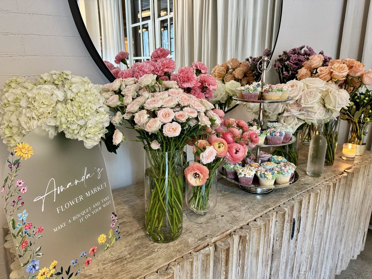A flower bar stocked with blooms for guests to build bouquets.